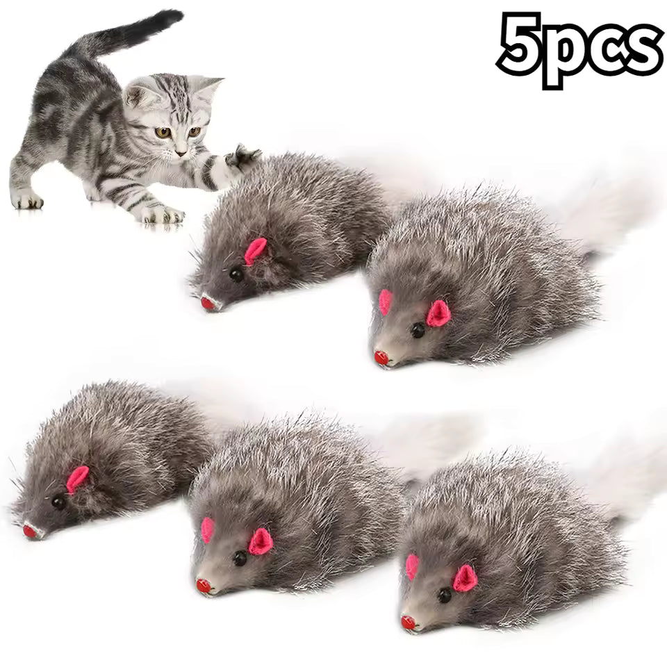 Five realistic grey false mouse cat toys with pink noses and long white tails, shown with a kitten batting at one of the toys in the background.