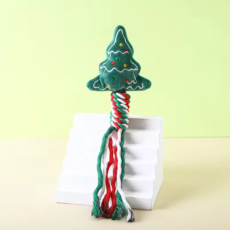 Durable Christmas dog rope toy featuring a green plush Christmas tree top and a braided red, white, and green cotton rope handle.