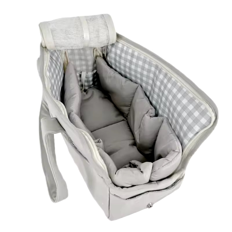 Three components of the gray dog carrier set: the bag, the matching quilted gray mat, and the detachable shoulder strap.