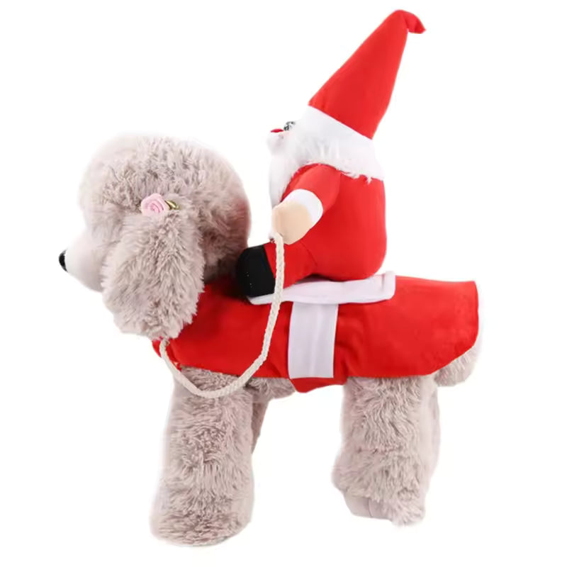 Full-body Santa Claus jumpsuit costume on a brown poodle/teddy dog, featuring a Santa hat, belt, and red and white leg cuffs.