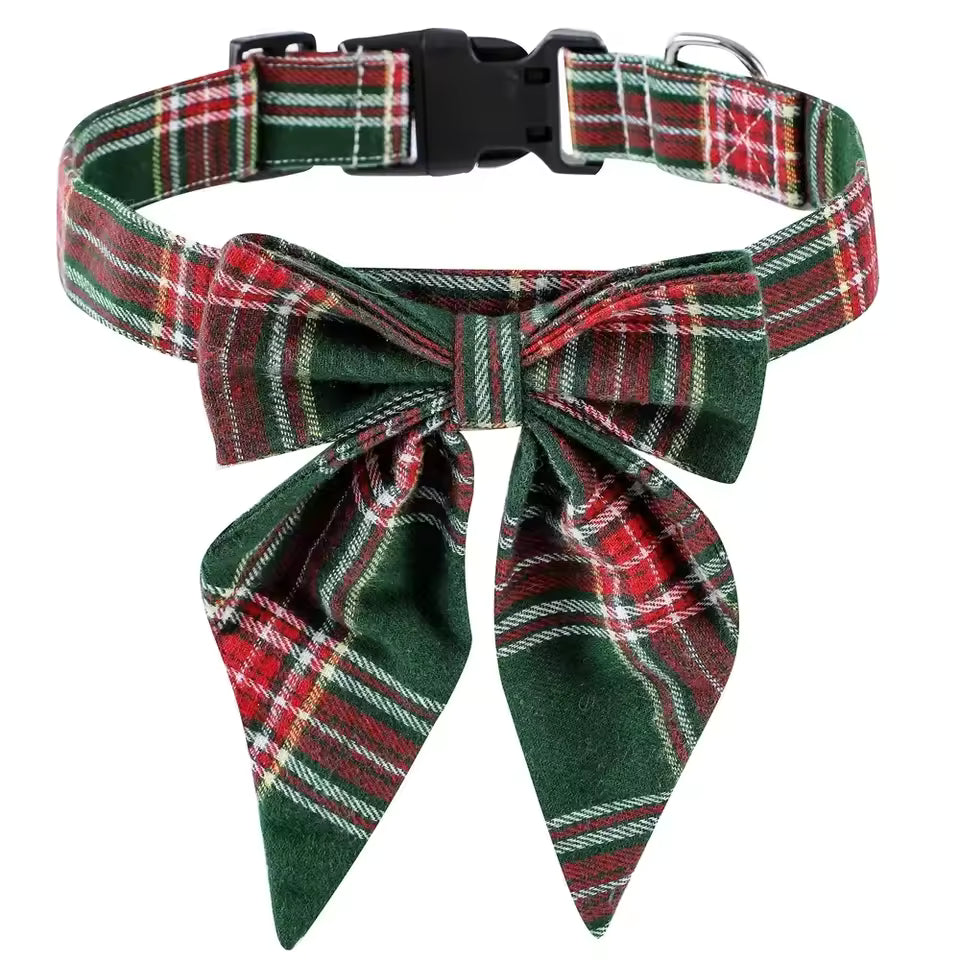 Adjustable pet bow tie with a predominantly green background featuring snowman and candy cane prints, with red trim and strap.