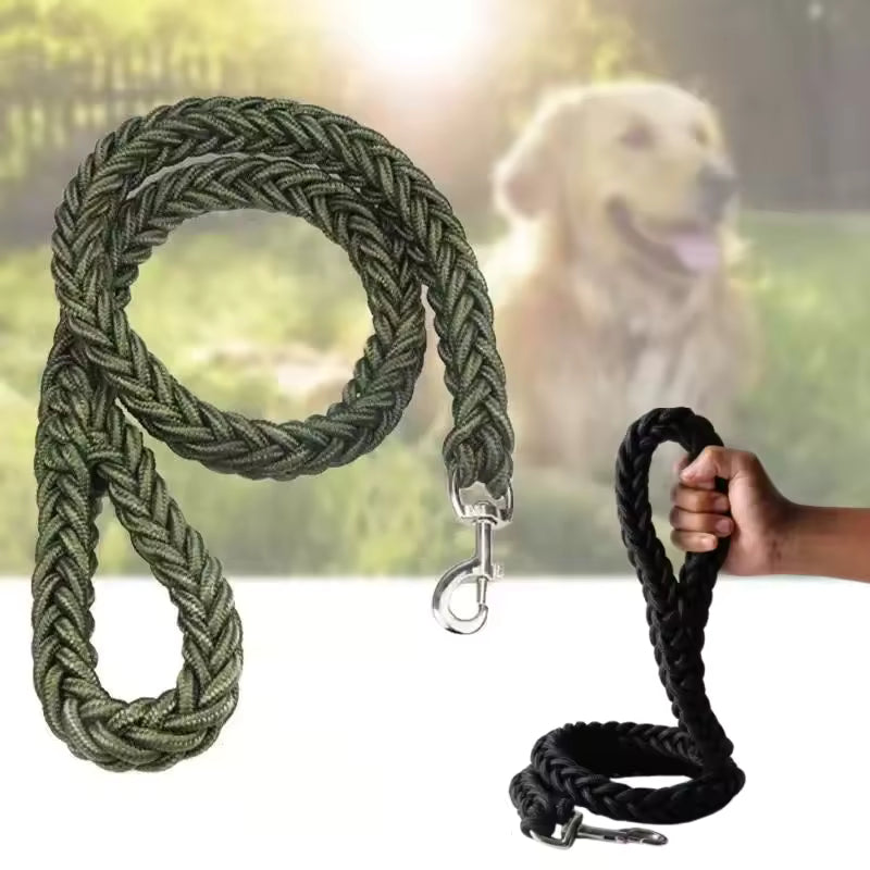 Thick, eight-strand braided traction rope dog leash in army green and black, with a large clip hook, shown in a park setting